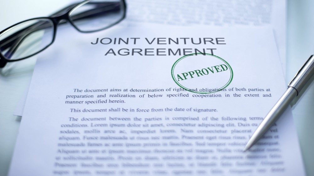 Im Joint Venture Vertrag werden die rechtlichen Details der Kooperation festgeschrieben Joint Venture Agreement